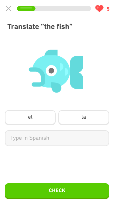 Screenshot of an exercise with the prompt 'Translate 'the fish'' and a large image of a fish. Below the fish are two buttons, one says 'el' and the other says 'la' (the Spanish words for 'the'), and below them is a blank for the learner to type the word in Spanish.